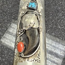 This is a Bic lighter holder made of silver and adorned with blue and red turquoise.