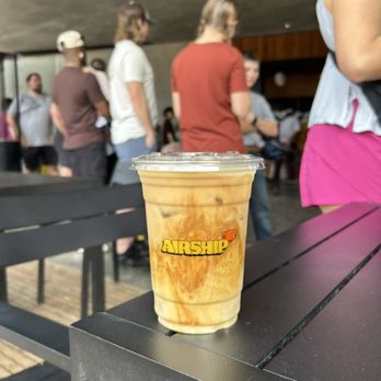 Airship Coffee - Iced oat milk latte - Coffee & Tea Near Me - Bentonville, Arkansas Airship Coffee - Iced oat milk latte - Coffee & Tea Near Me - Bentonville, Arkansas