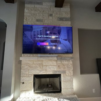 Home Automations - 75 inch tv above the fireplace - Home Theatre Installation Near Me