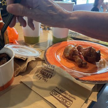 Pollo Campero - trying a little of everything. Dining area - Chicken Shop Near Me - Kyle, Texas