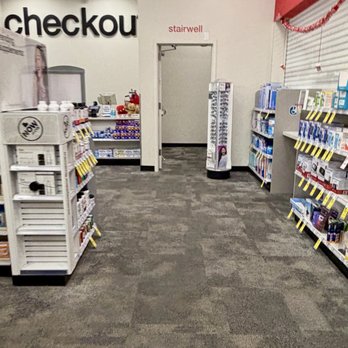 CVS Pharmacy - A CVS Pharmacy interior shows shelves stocked with products, a checkout counter, and a doorway labeled 'stairwell' in the background. - Drugstores Near Me - Austin, Texas