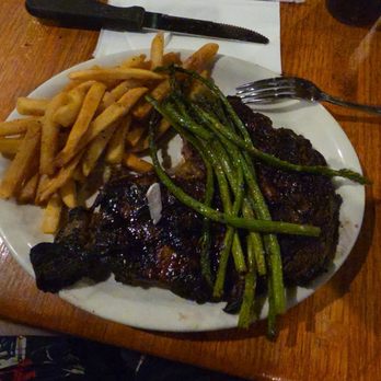 Jackson's Bar & Grill - Ribeye steak with crispy fries, and asparagus. 16oz Ribeye Steak* - Sports Bars Near Me - Las Vegas, Nevada Jackson's Bar & Grill - Ribeye steak with crispy fries, and asparagus. 16oz Ribeye Steak* - Sports Bars Near Me - Las Vegas, Nevada