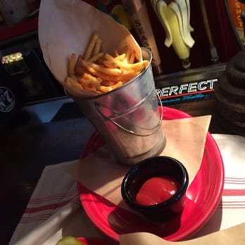 Grease Burger Beer and Whiskey Bar - A little pail of fries. Get the truffle catsup it's a must with the fries. - Burgers Near Me - West Palm Beach, Florida