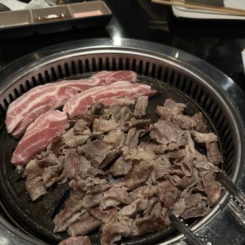 Chadol Korean BBQ - Pork belly (the uncooked meat on the grill) and brisket - Barbeque Near Me - Rockville, Maryland Chadol Korean BBQ - Pork belly (the uncooked meat on the grill) and brisket - Barbeque Near Me - Rockville, Maryland