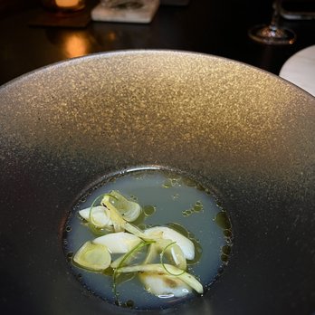 Maison Sun - Surf Clam  Clam Broth, Katsuobushi, Mayu Oil, Burnt Onion & Caramelized Fennel - French Near Me - Brooklyn , New York