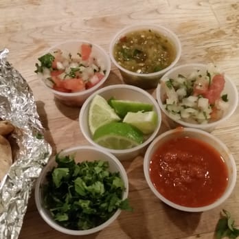 District Taco - Various condiments from the salsa bar to top my tacos - Mexican Near Me - Arlington, Virginia
