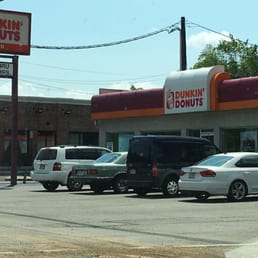  cars parked in front of dunkin donuts