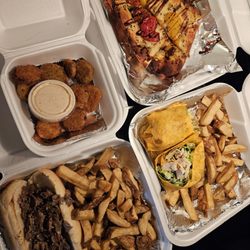 Sinkhole Saloon & Grill - Cheesesteak with fries - chicken caesar wrap - fried pickles - bruschetta