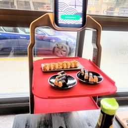 a tray of sushi and a tray of rolls a tray of sushi and a tray of rolls