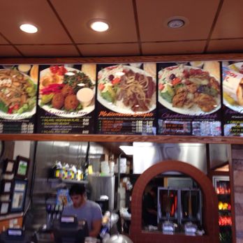 Petit Café - Menu display above cash register - Greek Near Me - El Segundo, California Petit Café - Menu display above cash register - Greek Near Me - El Segundo, California