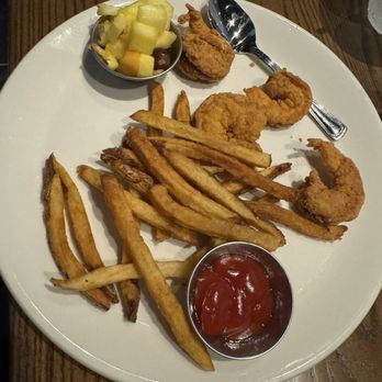 Burtons Grill & Bar - Kids meal - fried shrimp, fries, fruit, and pudding - New American Near Me - Mount Pleasant, South Carolina Burtons Grill & Bar - Kids meal - fried shrimp, fries, fruit, and pudding - New American Near Me - Mount Pleasant, South Carolina