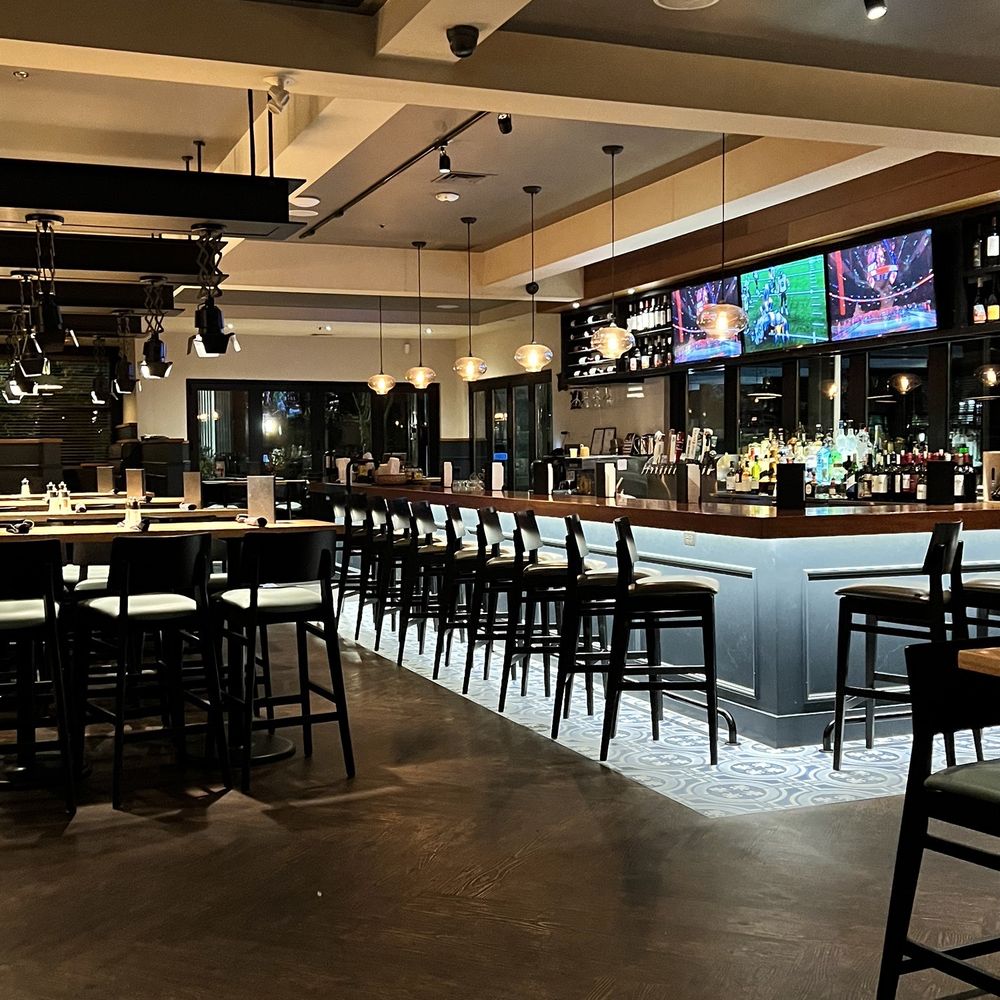 Milestones Restaurants - a bar with a lot of seating - Canadian (New) Near Me - West Vancouver, British Columbia Milestones Restaurants - a bar with a lot of seating - Canadian (New) Near Me - West Vancouver, British Columbia