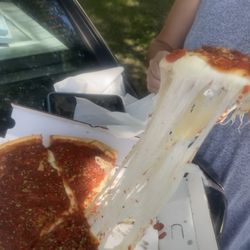 Milano's Pizza & Specialties - Chicago style deep dish cheese pizza
