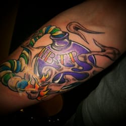 The Needle Bar Tattoo Parlor