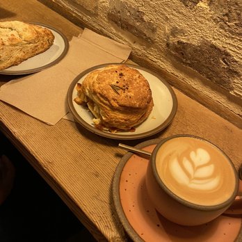 Harken Cafe - Small cappuccino, Brie & jam biscuit, and cheddar & chive scone - Coffee & Tea Near Me - Charleston, South Carolina