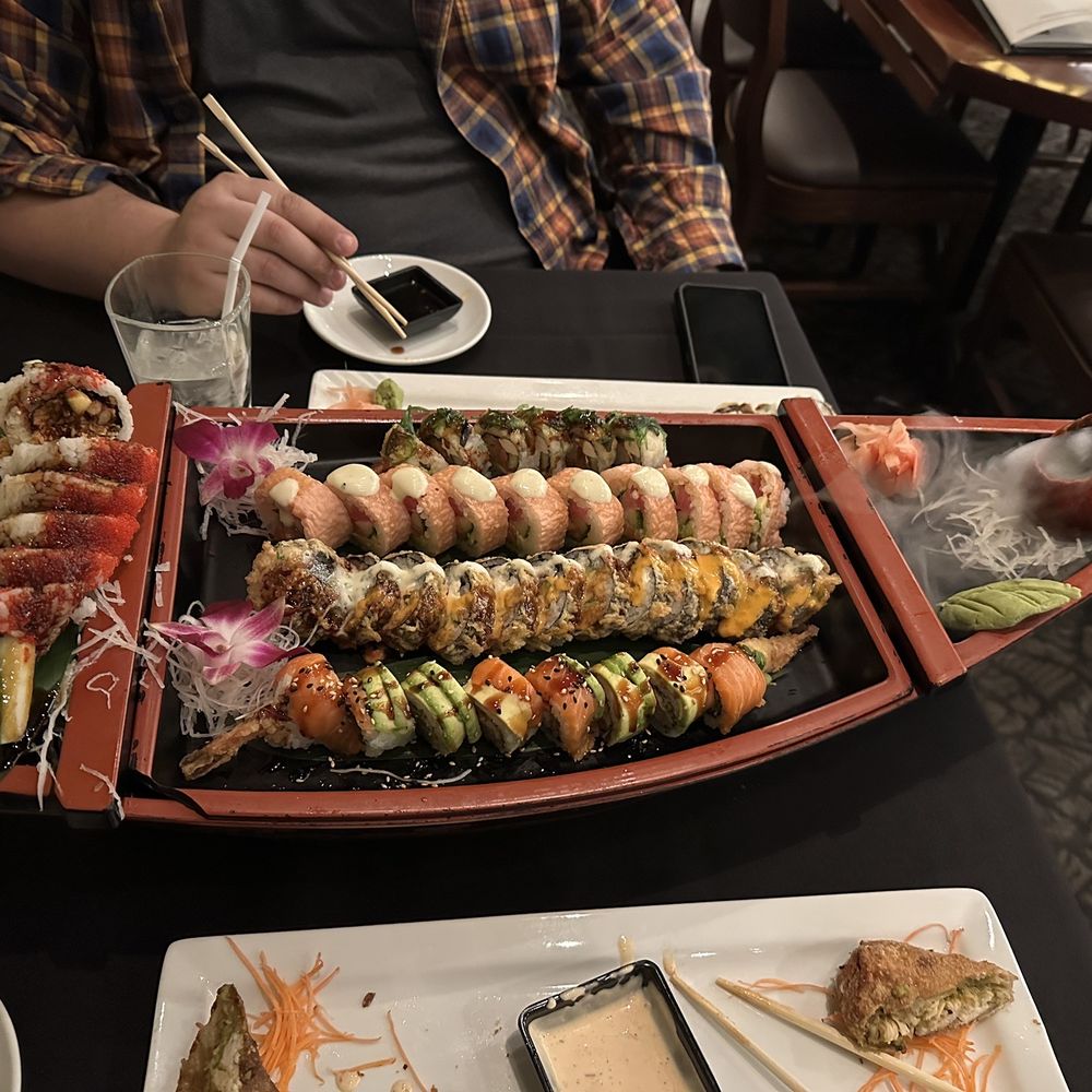 CRAVE - Spider, Godzilla, pink panther, King Kong, and #9 rolls. chicken and avocado egg rolls on plate - American Near Me - Bloomington, Minnesota CRAVE - Spider, Godzilla, pink panther, King Kong, and #9 rolls. chicken and avocado egg rolls on plate - American Near Me - Bloomington, Minnesota