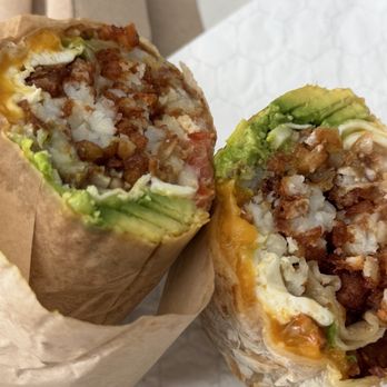 The Trough Sandwich Kitchen - Breakfast burrito with eggs, cheddar, avocado, tater tots, and pico de gallo in a tortilla. - Sandwiches Near Me - Irvine, California The Trough Sandwich Kitchen - Breakfast burrito with eggs, cheddar, avocado, tater tots, and pico de gallo in a tortilla. - Sandwiches Near Me - Irvine, California