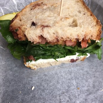 Nashoba Brook Bakery - Sundried tomato, tomato and olive tampande, goat cheese, spinach and tomato on olive bread - Bakeries Near Me - Concord, Massachusetts