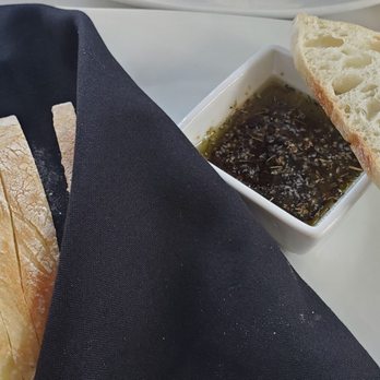Bella Ciao - Delicious warm bread. Crusty on the outside and soft inside. Delicious herbed dipping oil - Italian Near Me - Buffalo, New York