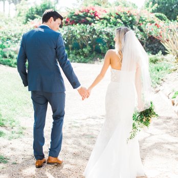 Megan Rose Events - Couple walking hand in hard after getting married - Wedding Planning Near Me Megan Rose Events - Couple walking hand in hard after getting married - Wedding Planning Near Me