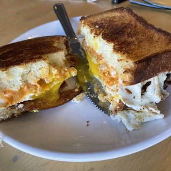 Black Dog Coffeehouse - Sunrise sandwich - ibis brioche toast, local eggs, bacon, white cheddar & sundried tomato mayo. - Coffee & Tea Near Me - Lenexa, Kansas