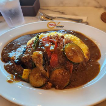 MAJI Curry - Regular sized omelette curry with pork cutlet and vegetables. Very filling - Japanese Curry Near Me - Irvine, California MAJI Curry - Regular sized omelette curry with pork cutlet and vegetables. Very filling - Japanese Curry Near Me - Irvine, California