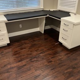 a corner desk in a room a corner desk in a room