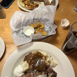 Fried pickles, beef tips with mashed potatoes, and the filet with shrimp. Fried pickles, beef tips with mashed potatoes, and the filet with shrimp.
