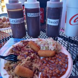 Pickin Pig Carolina Barbeque Parlor - SMALL BBQ plate with beans and slaw with table sauces.