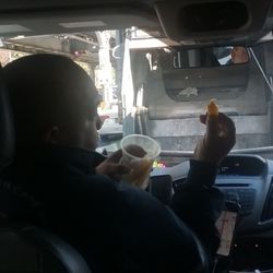 Transportation With Care Ambulette - Rude Pablo, driver eating and driving a TWCA ambulette on 10/21/22