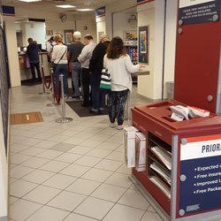 United States Postal Service Land Title Station - You can see the side table next to the woman closest to me. that table follows the line all the way down.