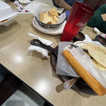 Tepatitlan Mexican Grill - Queso Flameado Tamales Grande Giant Tortilla Burrito Hamburger and Fries - Mexican Near Me - Houston, Texas Tepatitlan Mexican Grill - Queso Flameado Tamales Grande Giant Tortilla Burrito Hamburger and Fries - Mexican Near Me - Houston, Texas