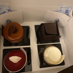 Caramel tower, tiramisu, raspberry cake, and white chocolate cheesecake Caramel tower, tiramisu, raspberry cake, and white chocolate cheesecake