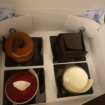 Norman Love Confections - Caramel tower, tiramisu, raspberry cake, and white chocolate cheesecake - Chocolatiers & Shops Near Me - University Park, Florida Norman Love Confections - Caramel tower, tiramisu, raspberry cake, and white chocolate cheesecake - Chocolatiers & Shops Near Me - University Park, Florida