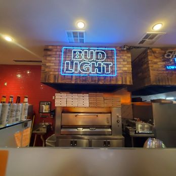 Brooklyn Pizzeria - a neon sign above a pizza oven - Pizza Near Me - Dallas, Texas Brooklyn Pizzeria - a neon sign above a pizza oven - Pizza Near Me - Dallas, Texas