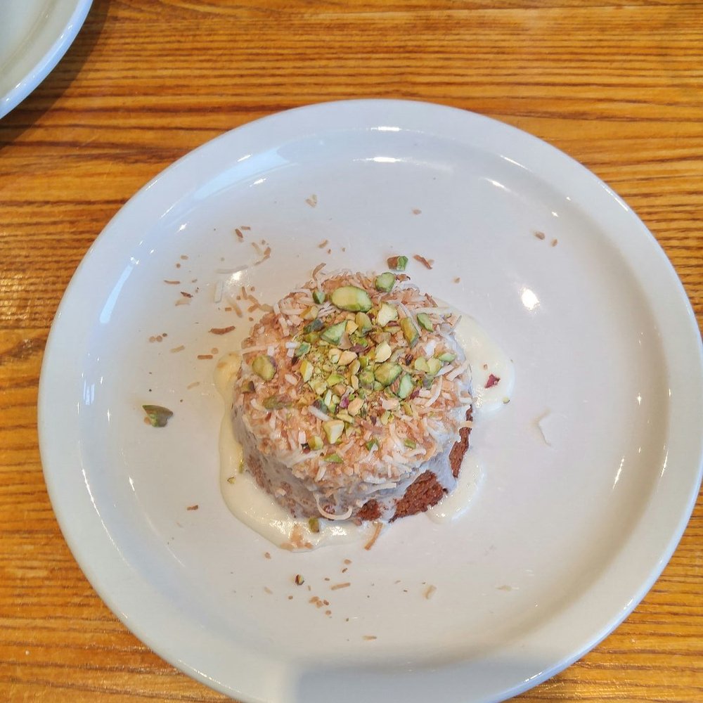 Levetto - Coconut cake with pistachios on top - Italian Near Me - Toronto, Ontario Levetto - Coconut cake with pistachios on top - Italian Near Me - Toronto, Ontario