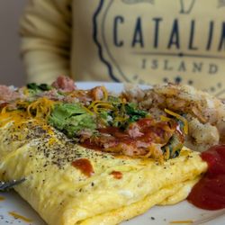 Pancake Cottage - Omelet with hash, avocado and cheese.