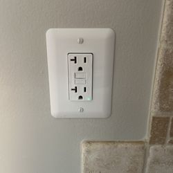 Affordable Painting and Repairs - Drilled and installed a new outlet by running wiring through the walls