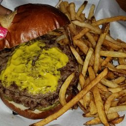 Double burger on pretzel bun w/mustard & grilled onions Double burger on pretzel bun w/mustard & grilled onions