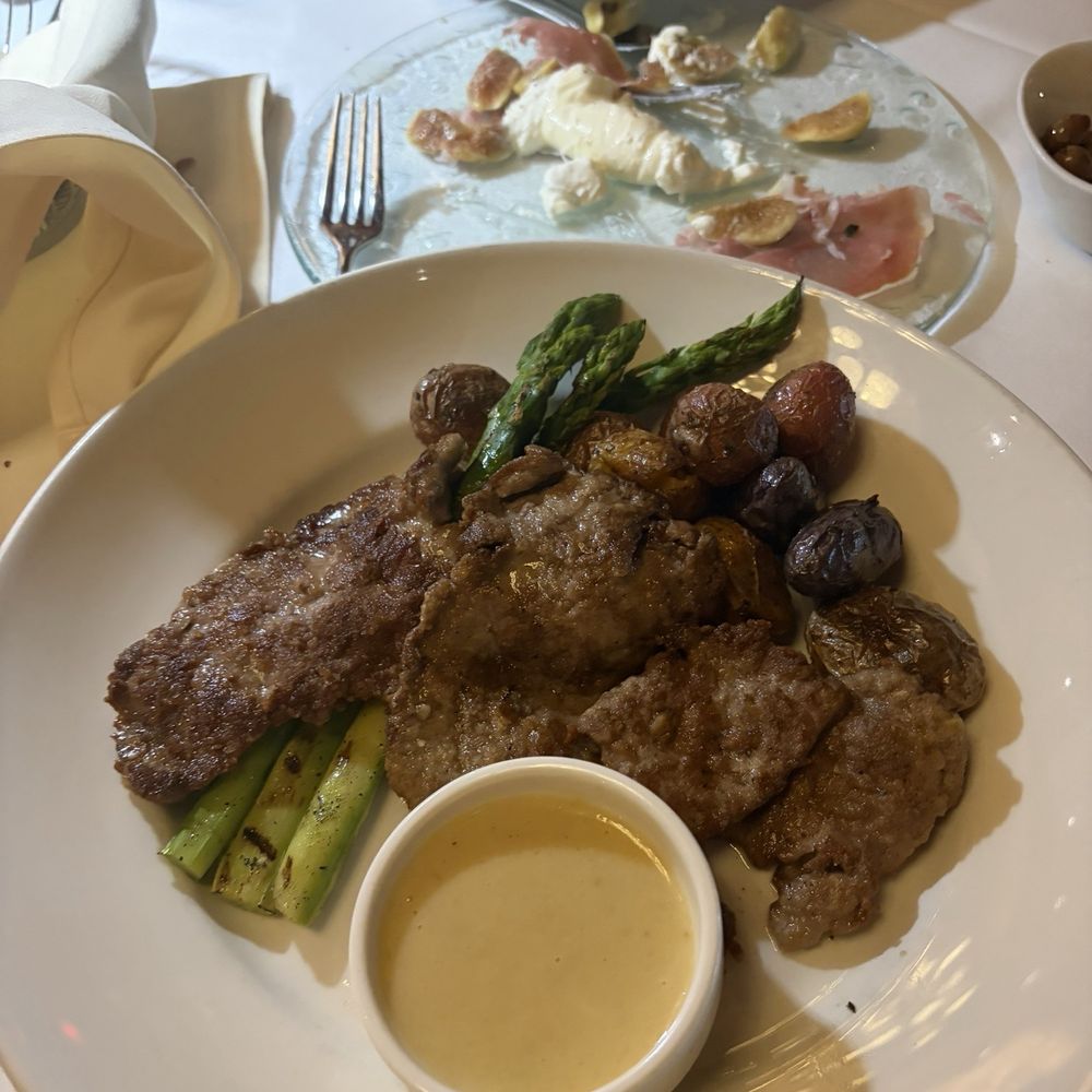 Bari Ristorante - SCALOPPINE DI VITELLO pan-seared thin veal cutlets, jumbo asparagus, roasted fingerling potatoes, lemon sauce - Italian Near Me - Houston, Texas Bari Ristorante - SCALOPPINE DI VITELLO pan-seared thin veal cutlets, jumbo asparagus, roasted fingerling potatoes, lemon sauce - Italian Near Me - Houston, Texas