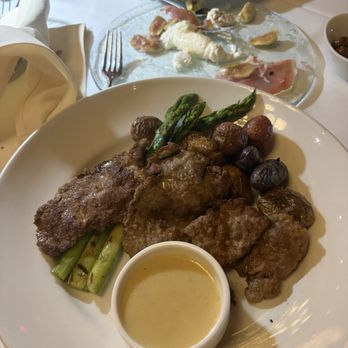 Bari Ristorante - SCALOPPINE DI VITELLO pan-seared thin veal cutlets, jumbo asparagus, roasted fingerling potatoes, lemon sauce - Italian Near Me - Houston, Texas Bari Ristorante - SCALOPPINE DI VITELLO pan-seared thin veal cutlets, jumbo asparagus, roasted fingerling potatoes, lemon sauce - Italian Near Me - Houston, Texas