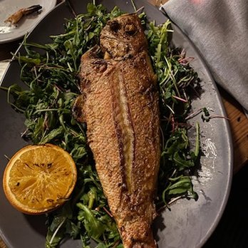 Tempest - Whole Fish.  You pour a reduction over it and the chargrilled orange made it taste even better. - Seafood Near Me - Charleston, South Carolina