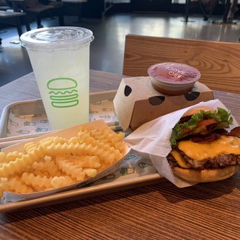 Shake Shack Old Fourth Ward - Double smoke stack with peppers, bacon and their special sauce. Added pickles lettuce and tomato. Very good burger medium well - Burgers Near Me - Atlanta, Georgia Shake Shack Old Fourth Ward - Double smoke stack with peppers, bacon and their special sauce. Added pickles lettuce and tomato. Very good burger medium well - Burgers Near Me - Atlanta, Georgia