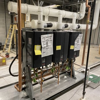 Corbin Plumbing Mechanical - 6 taskless water heaters ran on a manifold water and vent/exhaust! - Plumbing Near Me Corbin Plumbing Mechanical - 6 taskless water heaters ran on a manifold water and vent/exhaust! - Plumbing Near Me