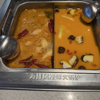 Haidilao - Spicy pork bone broth (left) and fish maw and chicken broth (right) - Hot Pot Near Me - Fremont, California Haidilao - Spicy pork bone broth (left) and fish maw and chicken broth (right) - Hot Pot Near Me - Fremont, California