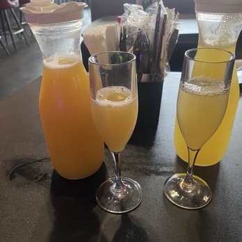 7th And Grove - OJ mimosa (left) Pineapple mimosa (right) 8/10 - Southern Near Me - Tampa, Florida
