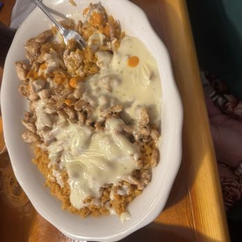 Abuelas Mexican Brunch - Arroz Con Pollo (grilled chicken pieces on a bed of rice topped with cheese dip). - Breakfast & Brunch Near Me - Jacksonville, Florida Abuelas Mexican Brunch - Arroz Con Pollo (grilled chicken pieces on a bed of rice topped with cheese dip). - Breakfast & Brunch Near Me - Jacksonville, Florida