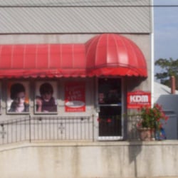 KDM Hair Designs - An entrance with a large parking lot is available in the rear of the building.