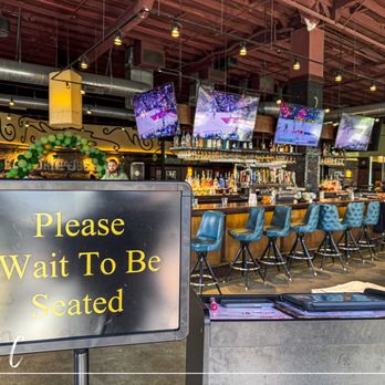 Bar Louie - Waiting for the host. Bar in the background - Bars Near Me - Tustin, California