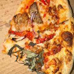 Kook Dogg Cafe - Wise guy pizza first bite sold!